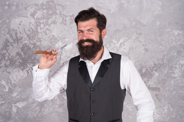Bearded man hold vintage razor. Shaving with straight razor. Brutal hairstylist in barbershop....