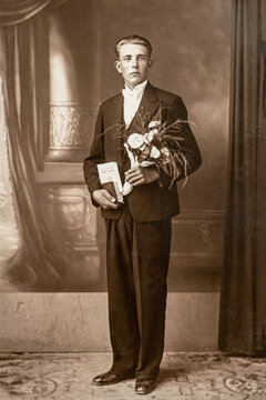 Germany - CIRCA 1920s: Young male portrait standing in studio Vintage Carte de Viste art deco era photo. College graduation