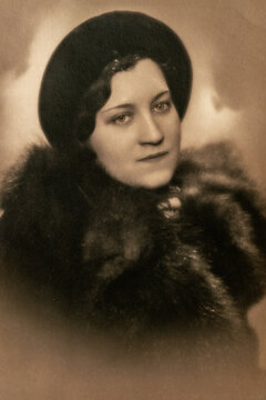 Germany - CIRCA 1930s: Portrait of female in studio Women wearing fur coat and hat. Close up. Vintage Carte de Viste Art Deco era photo