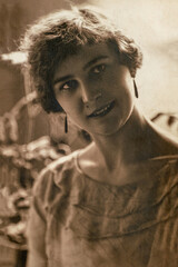 Latvia - CIRCA 1920s: Portrait of female in studio, Vintage Carte de Viste Art Deco era photo