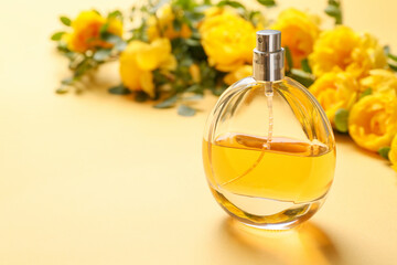 Bottle of floral perfume on color background
