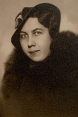 Germany - CIRCA 1930s: Portrait of female in studio. Women wearing fur coat and hat. Close up. Vintage Carte de Viste Art Deco era photo