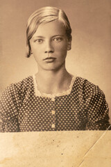 Germany - CIRCA 1930s: Portrait of young female in studio. Close up face. Vintage Art Deco era photo