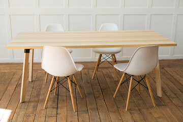 stylish chairs with a table in the office interior