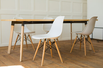 stylish chairs with a table in the office interior