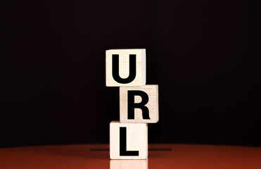 Letters abbreviation url www on wooden cubes, on a dark background, light wooden cubes signs,...