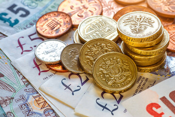 British coins stack on black, pound sterling,Business concept