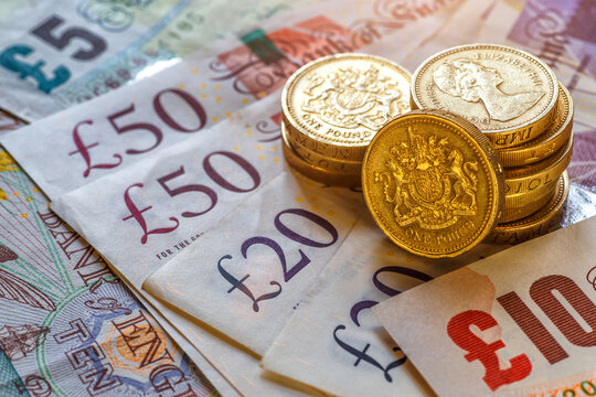 British coins stack on black, pound sterling,Business concept