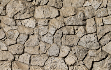Wall made of natural rocks and concrete