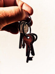 Human hand with vintage keys - closeup isolated photography