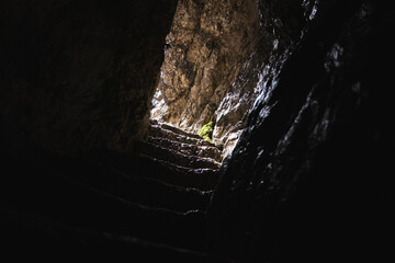 Standing under a waterfall on a sunny day