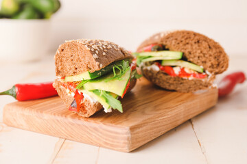 Tasty cucumber sandwiches on table