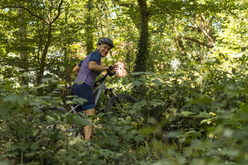 woman doing mountain biking among nature