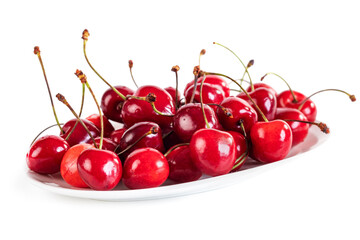 Obraz na płótnie Canvas Sweet red cherry berries on a plate isolated on white background