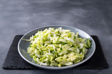 Fresh cabbage salad with cucumber and fennel. Healthy and diet food concept.