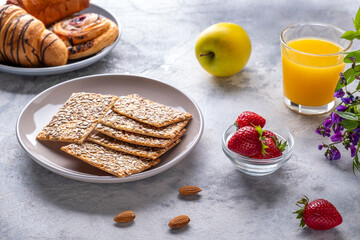 Small loafs with sunflower seeds, orange juice and fresh berries