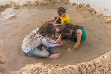 Children playing sand curiosity