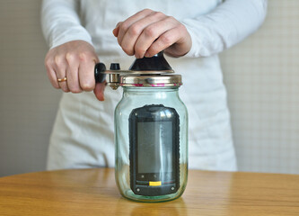 female hand cans the phone, without connection