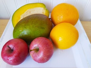 fresh fruits on a plate