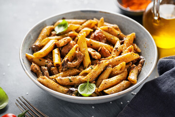 Pasta penne with mushrooms and sauce