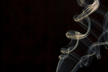 yellow smoke on black background