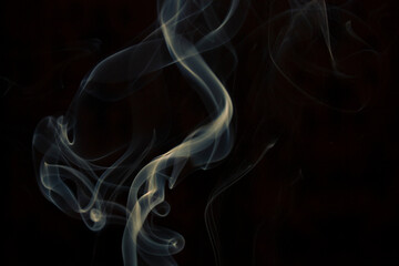 yellow smoke on black background