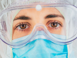 Caucasian doctor. Tired and exhausted scientist or nurse wearing mask.