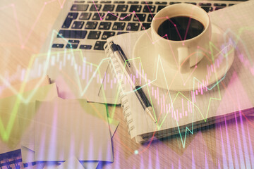 Double exposure of forex chart drawing and desktop with coffee and items on table background....