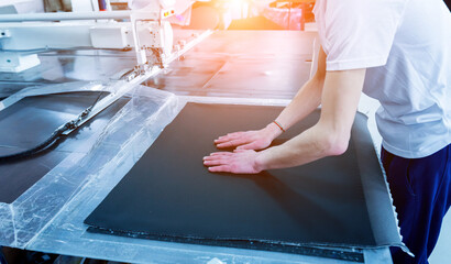 Fabric industry production line. Textile factory. Working tailoring process