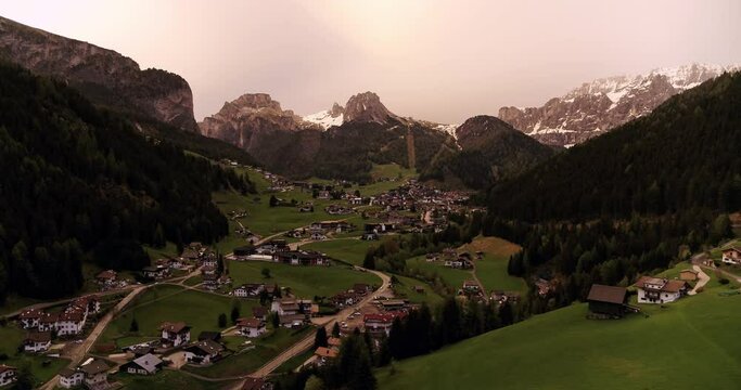 Sunset over Selva Val Gardena in South Tyrol. Aerial over Wolkenstein in Spring