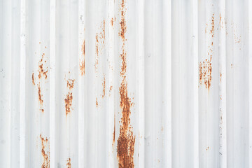 Red spots of rust on the white metal texture construction copy space for text title abstract