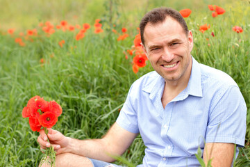 man in poppy field, poppies flowers bouquet