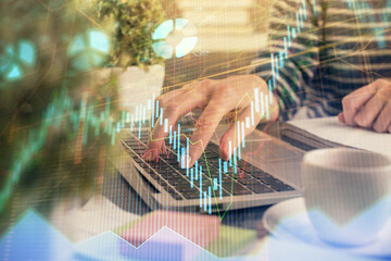 Double exposure of woman hands typing on computer and forex chart hologram drawing. Stock market invest concept.