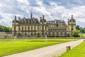 Fototapeta na wymiar Famous Chateau de Chantilly (Chantilly Castle, 1560), is a historic chateau located in town of Chantilly, Oise, Picardie, France. 