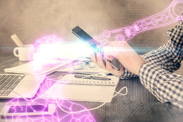 Double exposure of man's hands holding and using a digital device and AR glasses drawing. Virtual reality concept.