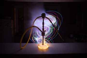 Hookah hot coals on shisha bowl with black background. Stylish oriental shisha. Shisha Concept