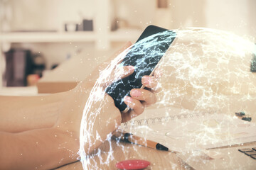 Double exposure of man's hands holding and using a phone and social network theme drawing.