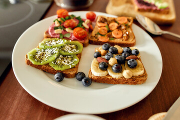 Set with toast bread and different healthy vegetarian toppings on the plate. Vegetarianism, healthy food concept