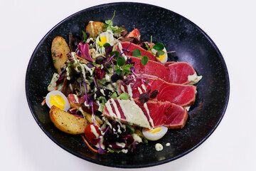 classic nicoise salad with seared tuna and crunchy vegetables