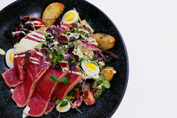 classic nicoise salad with seared tuna and crunchy vegetables