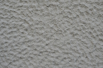 Grayish white stone background, with a porous and hard texture