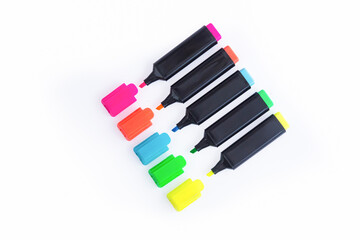 Five Colorful Markers On A White Background, Top View. Arranged in a straight line with Open Caps.