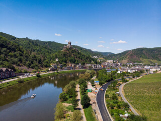 With the bike on the cycle path through the countryside along the river Moselle in...