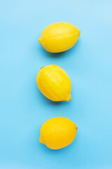 Fresh lemon on blue background.