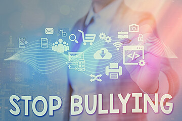 Writing note showing Stop Bullying. Business concept for voicing out their campaign against...
