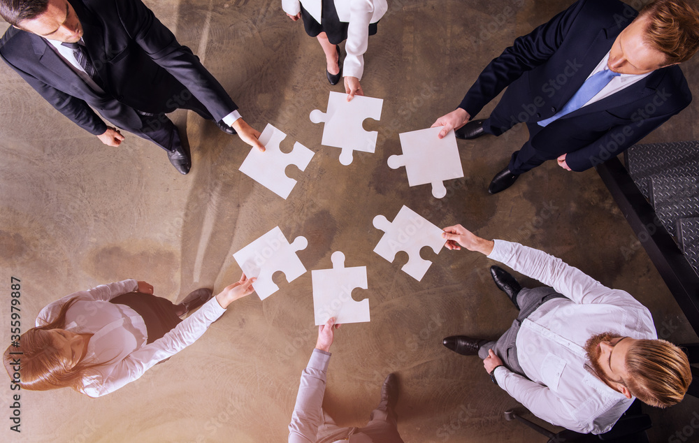 Poster teamwork of partners. concept of integration and startup with puzzle pieces