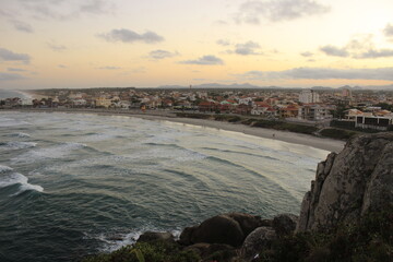 Beautiful sunset over the ocean and the city
