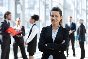 Portrait of a business woman with colleagues on background