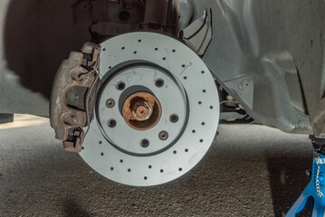 New assemble perforated brake disc on car