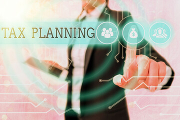 Writing note showing Tax Planning. Business concept for analyzing financial income and planning...